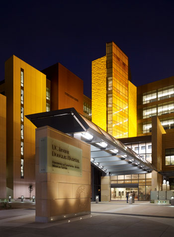 a picture of uci health orange, formerly uci medical center, at night. the sign in front says uci douglas hospital, the main building.