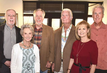 “UC Irvine has always been part of who we are,” says Ann Quilter (lower left wearing a white sweater). “Our family believes deeply in building community and in supporting the people and places that make a difference. UCI MIND represents hope – not just for scientific breakthroughs but for the families and caregivers who face Alzheimer’s every day.” She’s joined here by family members (from left) Chris, Charles, Patrick, Patty and Matt Quilter. The photo is shot indoors in front of a window.