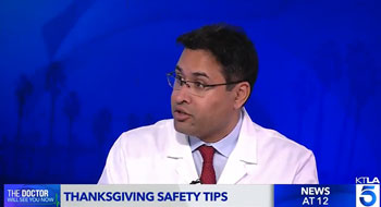 uci health regional burn center medical director dr syed f saquib speaks about preventing burns on Thanksgiving in the ktla the doctor will see you now studio in front of a blue background
