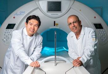 “This award gives us the opportunity to assess the lymphatic system in ways that haven’t been possible before,” says lead investigator Sabee Molloi (right), UC Irvine professor of radiological sciences, here with co-investigator Cholsoon Jang, assistant professor of biological chemistry, and a high-end CT scanner. “Our goal is to make diagnosis more precise and treatment decisions more informed, without putting additional burden on patients.” Steve Zylius / UC Irvine
