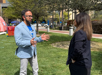 uci health gastroenterologist dr jason samarasena speaks to a reporter during dress in blue day for colon cancer awareness