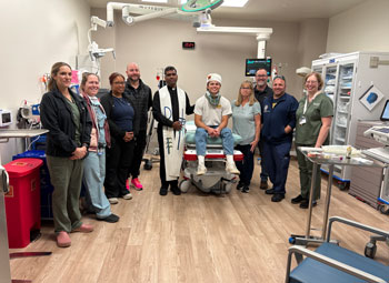 the uci health emergency medicine team and clergy participate with a servite high school student during an every 15 minutes drunk driving prevention program