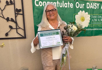 uci health nurse cynthia bear holds her daisy award