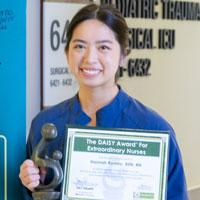 uci health nurse hannah romney holds her daisy award for nursing excellence