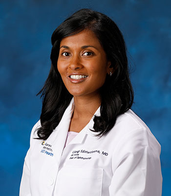 UCI Health reconstructive eye surgeon Dr. Lilangi Ediriwickrema wears a white coat in her official portrait.