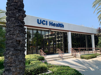 uci health family health center anaheim exterior with a palm tree and steps leading up to the entrance