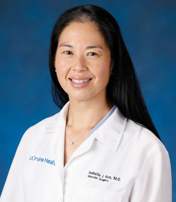 uci health vascular surgeon dr. isabella kuo wearing a white coat in front of a blue studio background