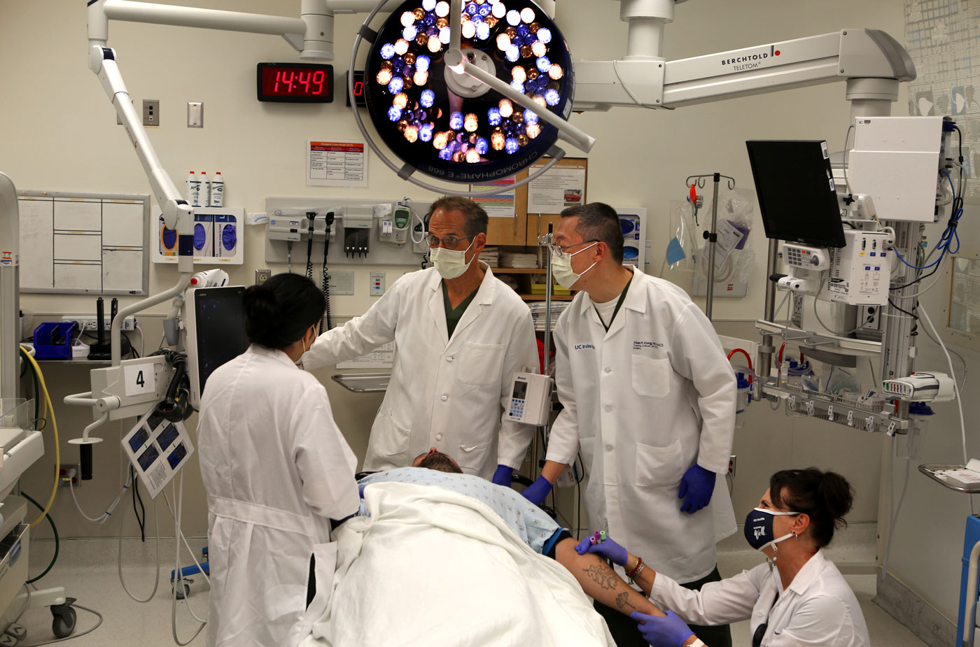 a uci health emergency medicine physician leads a team of physicians during a trauma