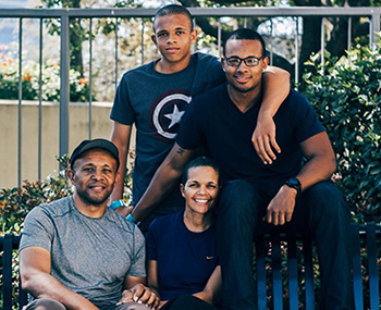 Dominic Valentine, center, with husband Fred, left; son Daniel, 17, at top, and son Chris, 22, at right.