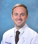 Dr. Theodore Bryan, a fellowship-trained UCI Health radiologist who specializes in diagnostic and interventional radiology, wearing a whitecoat.