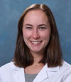  Dr. Carolyn E. Cookson, a board-certified UCI Health psychiatrist who specializes in child and adolescent psychiatry, wearing a whitecoat.