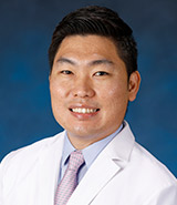 Jacob Hwang, ND, who is pictured in his lab coat, is a licensed UCI Health specialist in naturopathic medicine. 