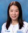 Dr. Holly M. Yong, a board-certified UCI Health surgical oncologist, wearing a whitecoat