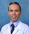 Dr. Mo Ziari, a board-certified UCI Health hematologist and medical oncologist, wearing a whitecoat.