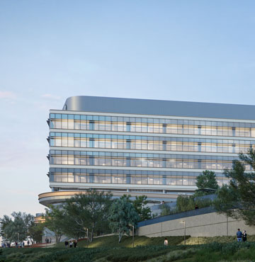 view of uci health irvine and the chao family comprehensive cancer center and ambulatory care building with the marsh in the foreground