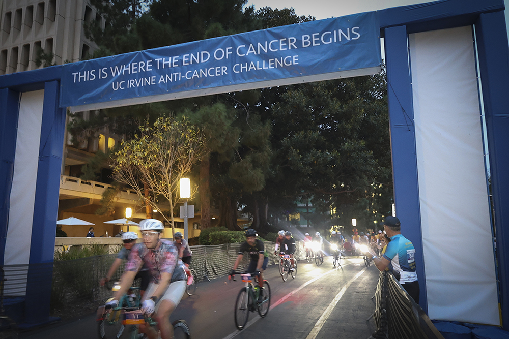 before dawn, cyclists start the anti cancer challenge race at the starting line
