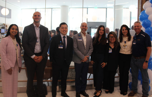 uci health leadership poses for a photo indoors at the opening of the tony and daisy fan family cafe at the uci health chao family cancer center and ambulatory care building in Irvine