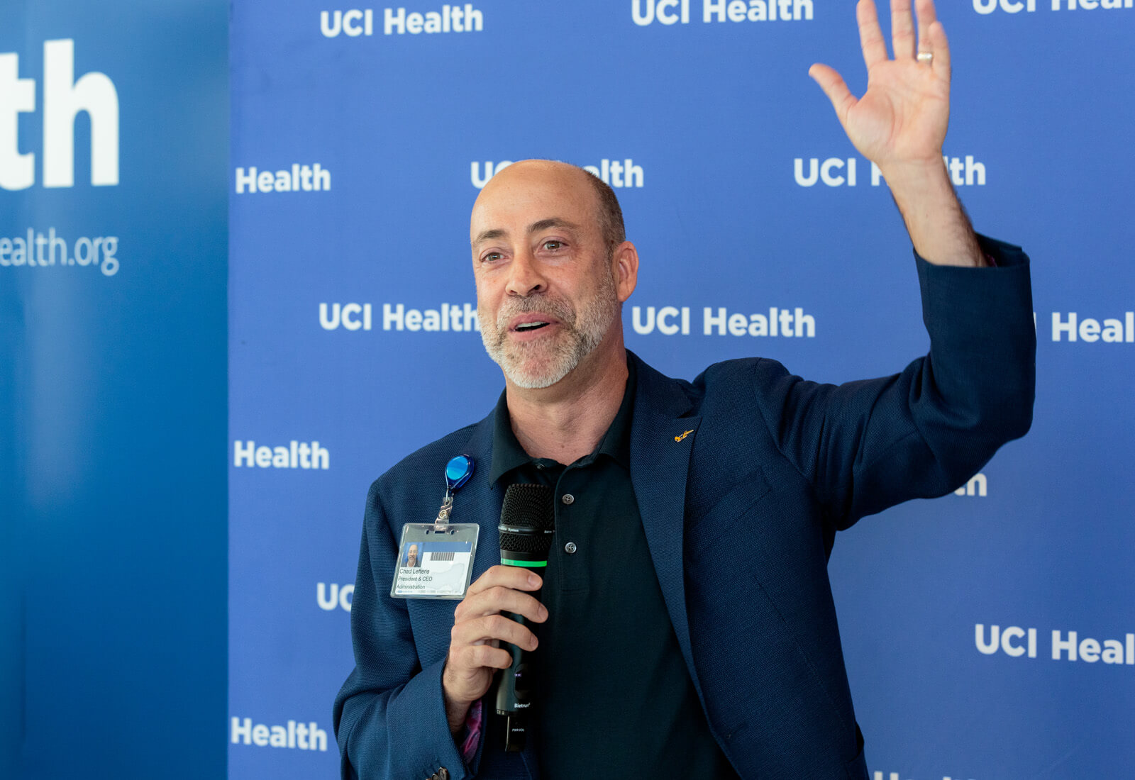 uci health president and ceo chad t lefteris speaks in front of the step and repeat at the uci health irvine substantial completion event on sept 19 2025