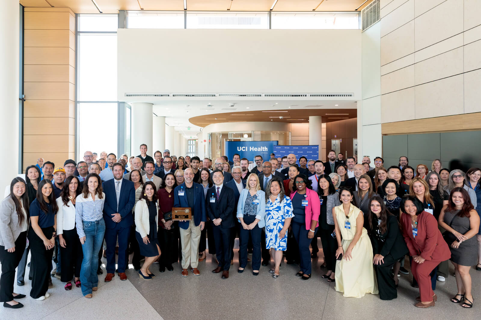 uci health and hensel phelps leaders pose for a group photo at the uci health irvine substantial completion event on sept 19 2025