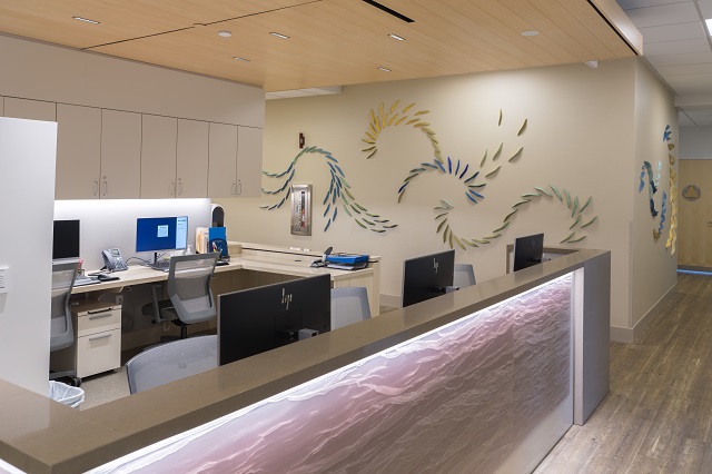 UCI Health — Newport Beach nurses station includes soothing lighting and unique artwork.