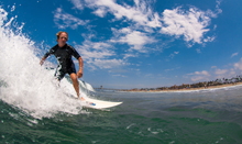 Charles Scalice of Seal Beach was determined to survive rectal cancer and keep surfing.