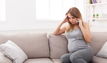pregnant woman calling doctor