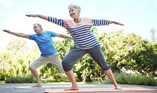 man and woman doing yoga for arthritis
