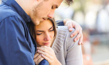 man comforting woman with anxiety