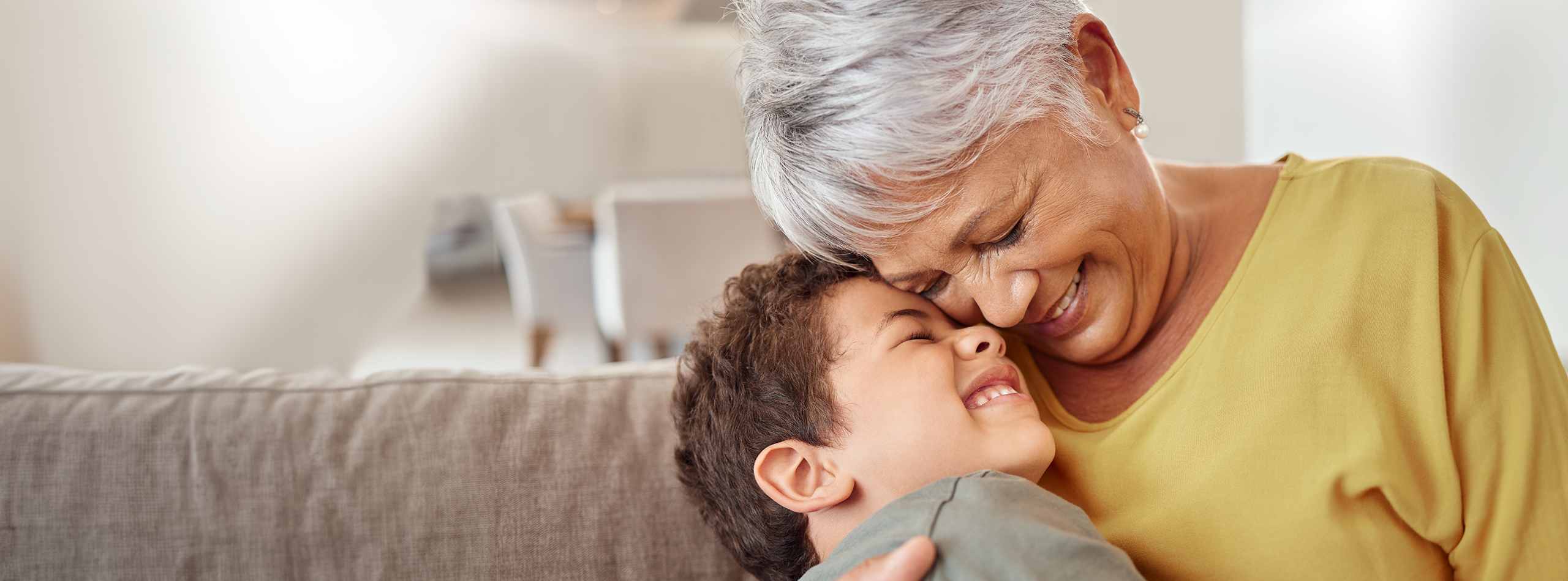 Elderly women hugging her grandson