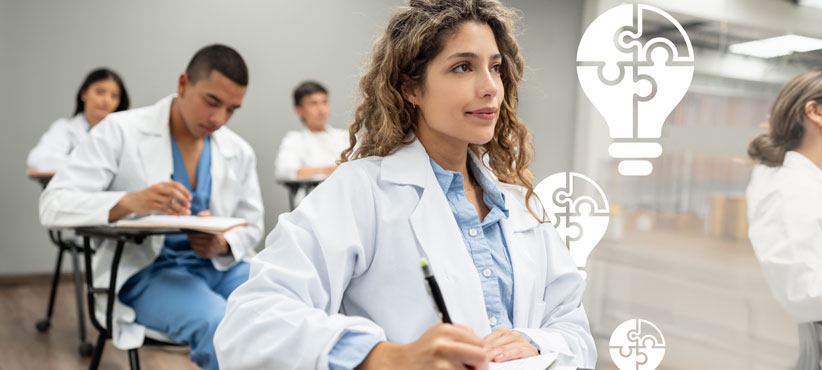 Young female med student prepares to take notes in class