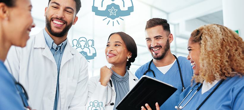 Doctors triumphantly smile in a group